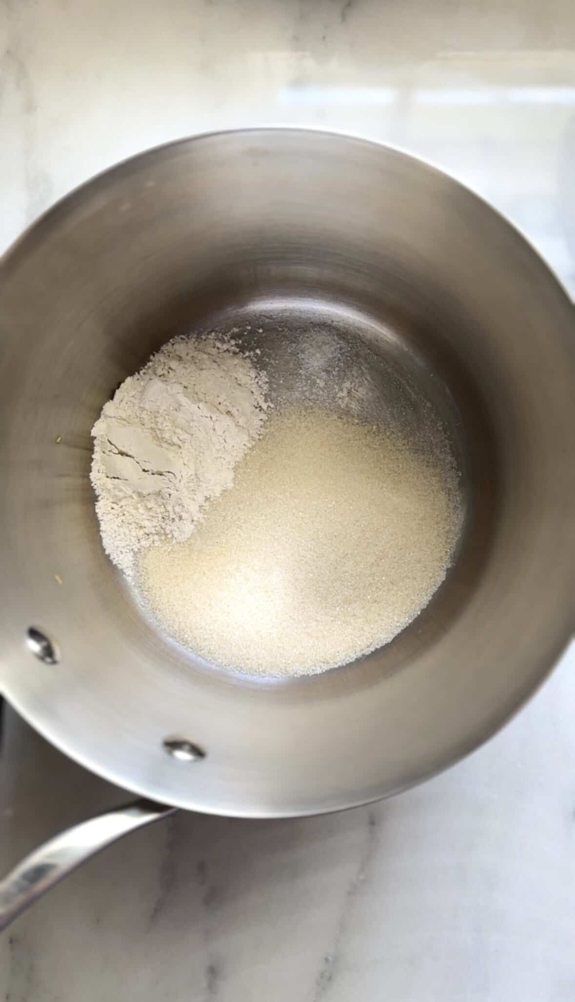 Add the dry ingredients of the banana frosting into a saucepan.