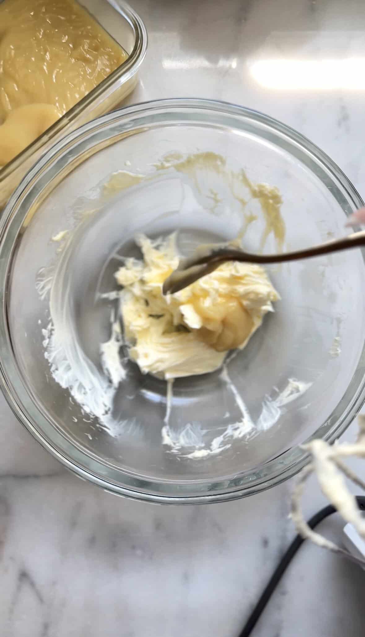Add the frosting base to the mixed butter.