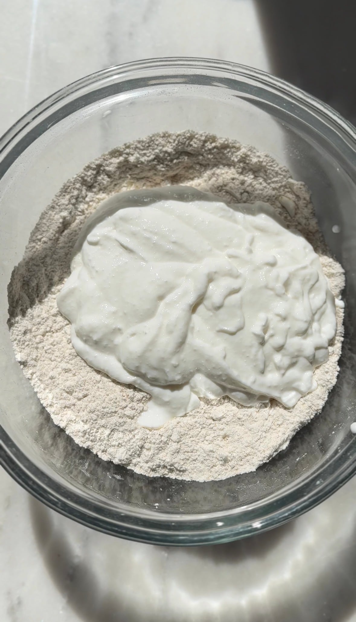 Add the cottage cheese to the bowl to make the pumpkin cottage cheese cinnamon roll dough.