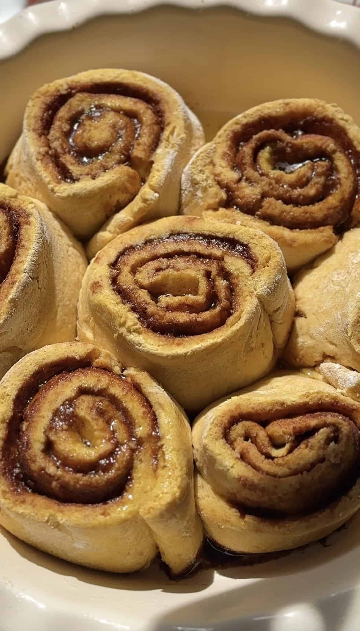 Pull out the pumpkin cottage cheese cinnamon rolls of the oven and let them cool before frosting.