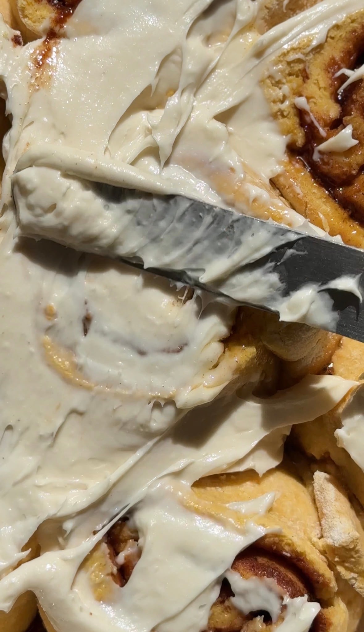 Spread the cream cheese frosting to the top of the baked and cooled pumpkin cottage cheese cinnamon rolls.