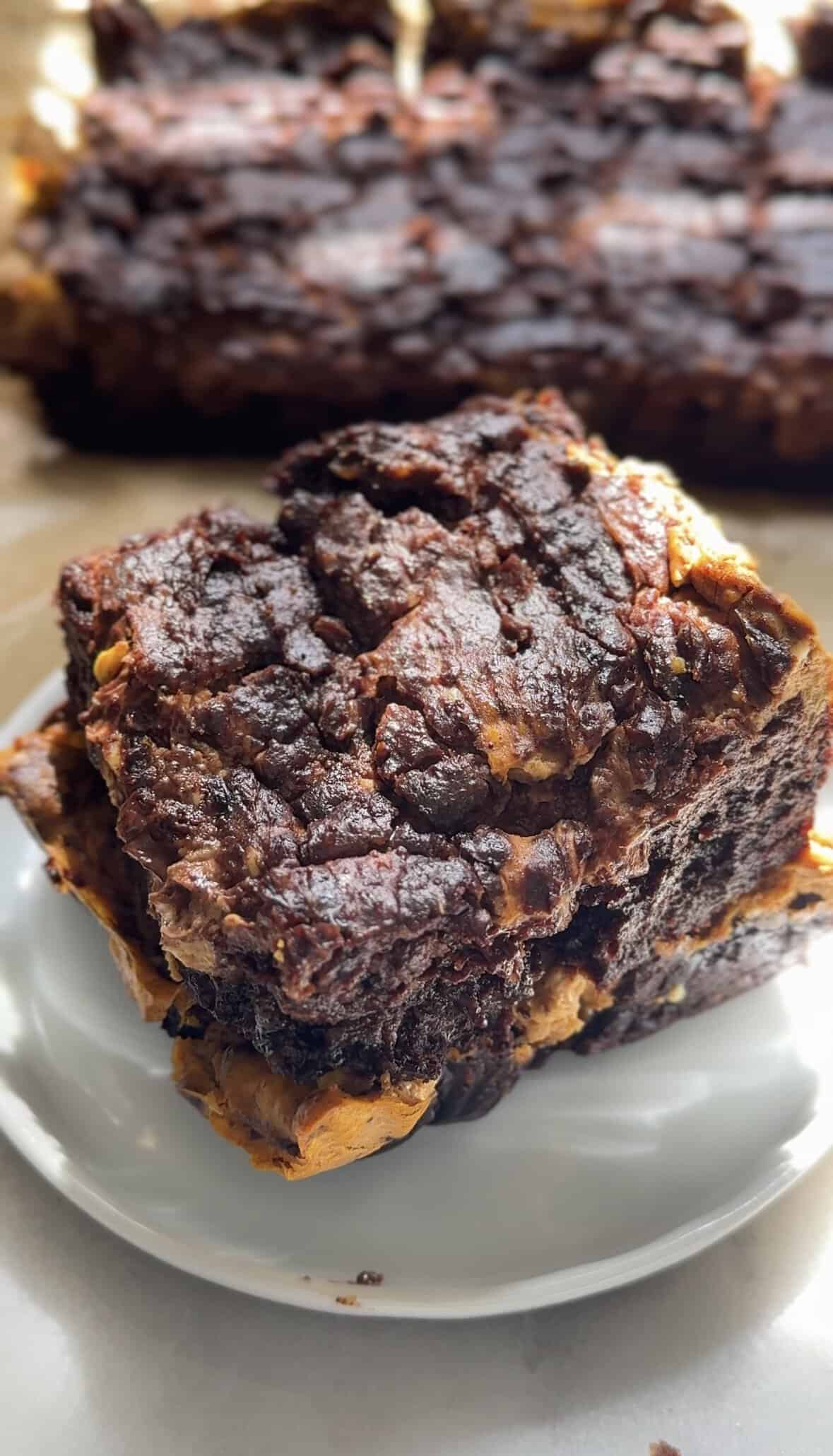 Cut Pumpkin Brownies squares on a plate.