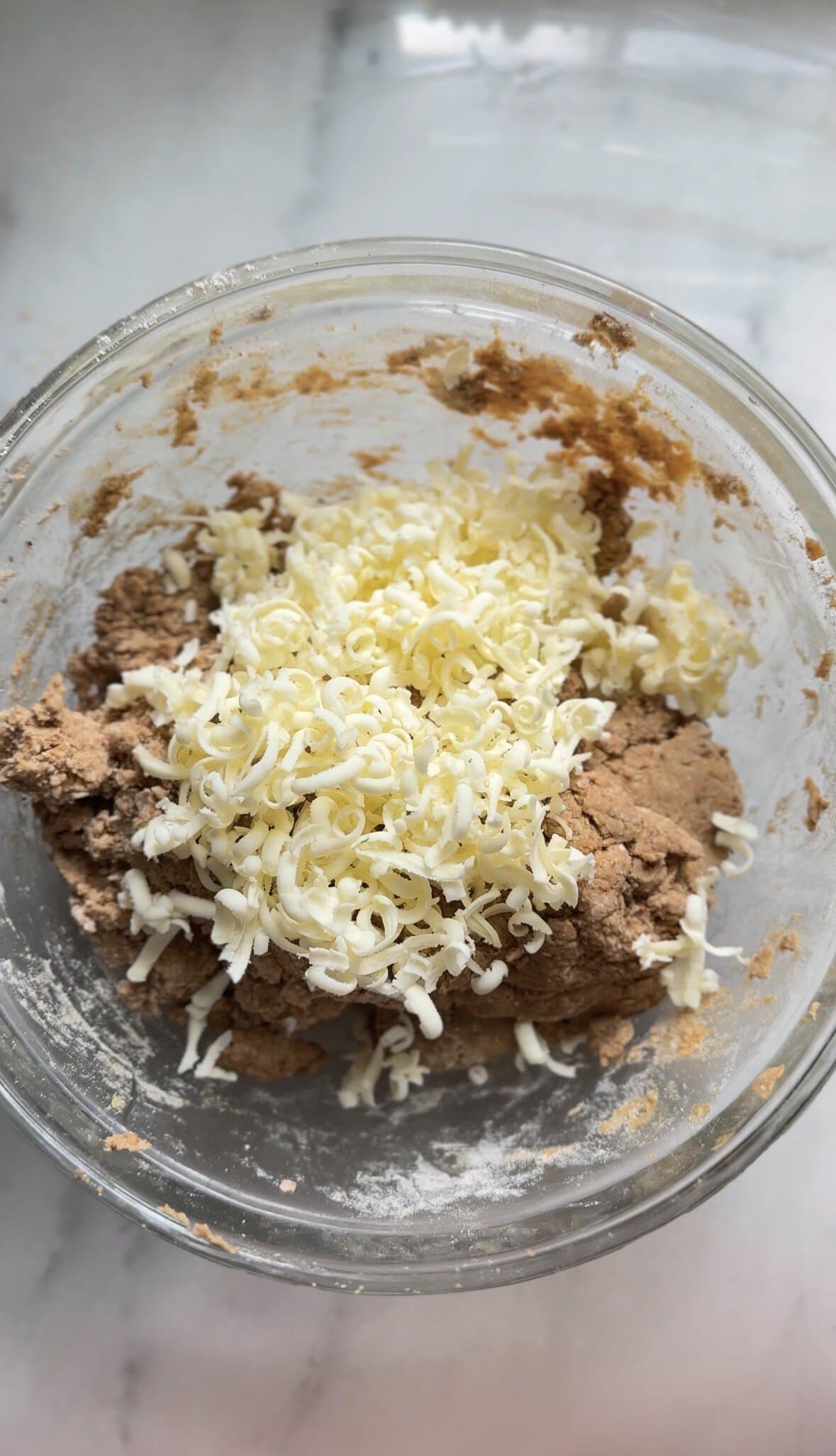 Frozen butter shredded on top of the rest of the Pumpkin Cottage Cheese Scone dough.
