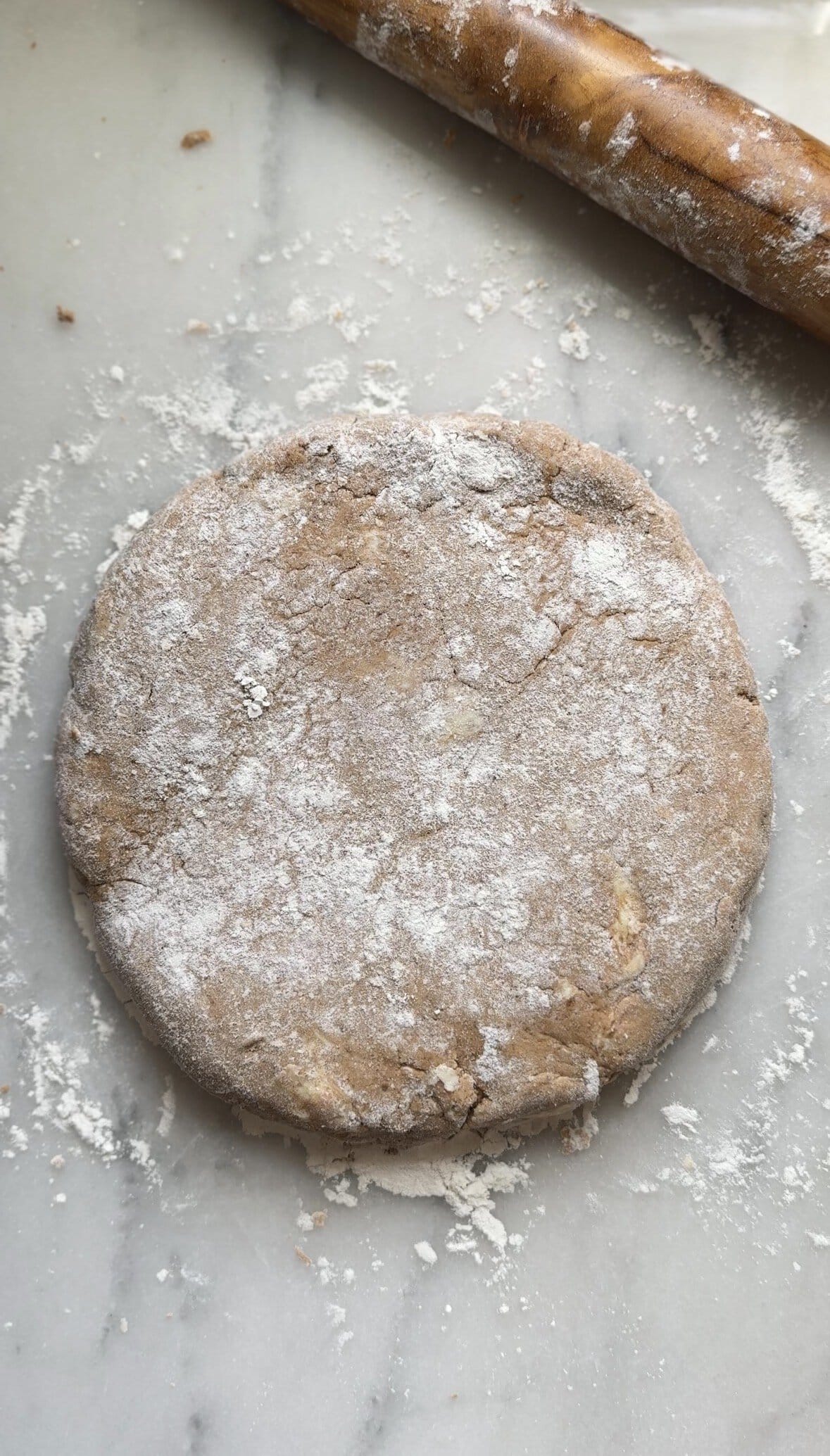 A picture of the rolled out Pumpkin Cottage Cheese Scone dough before cutting into wedges.