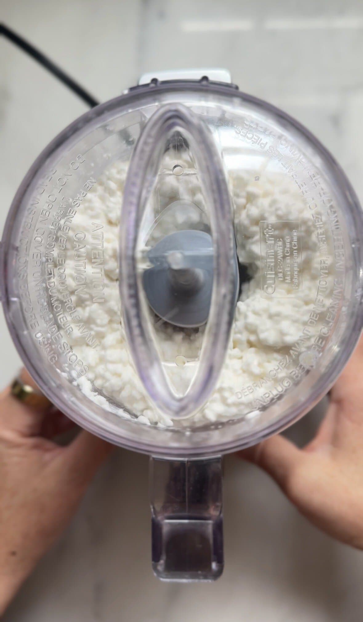 Whip the cottage cheese in a food processor.