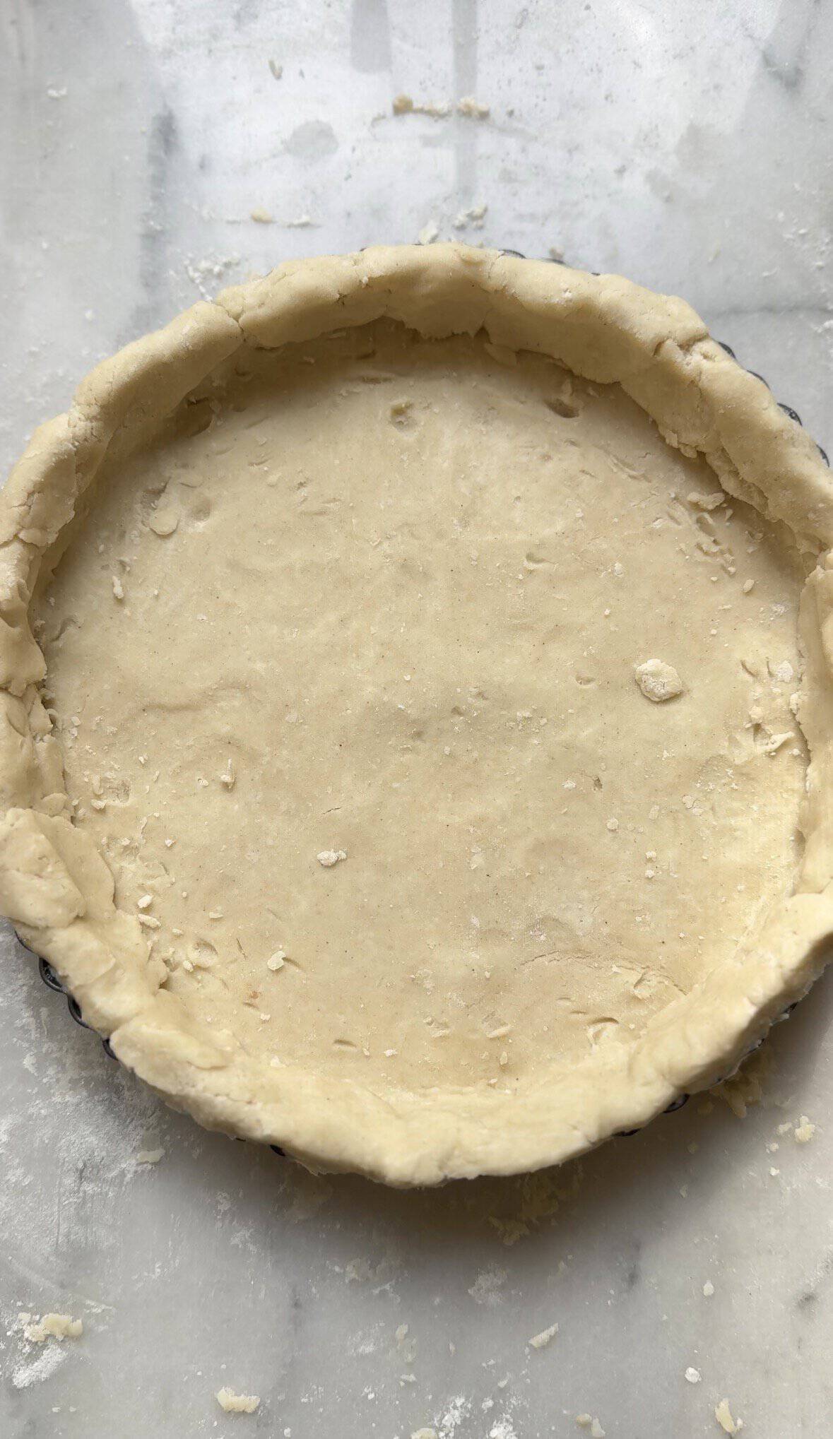 Gluten Free Caramelized Onion Quiche slice on a plate with a fork.