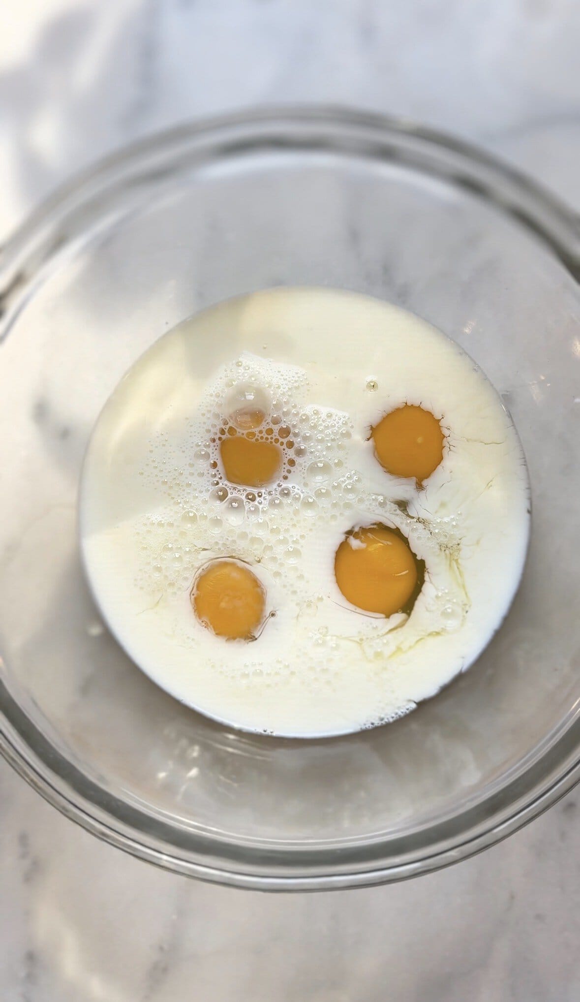 Add milk and eggs into a bowl.