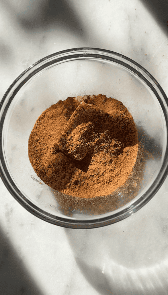 Add cinnamon and coconut sugar to the bowl for the gluten-free cinnamon rolls.