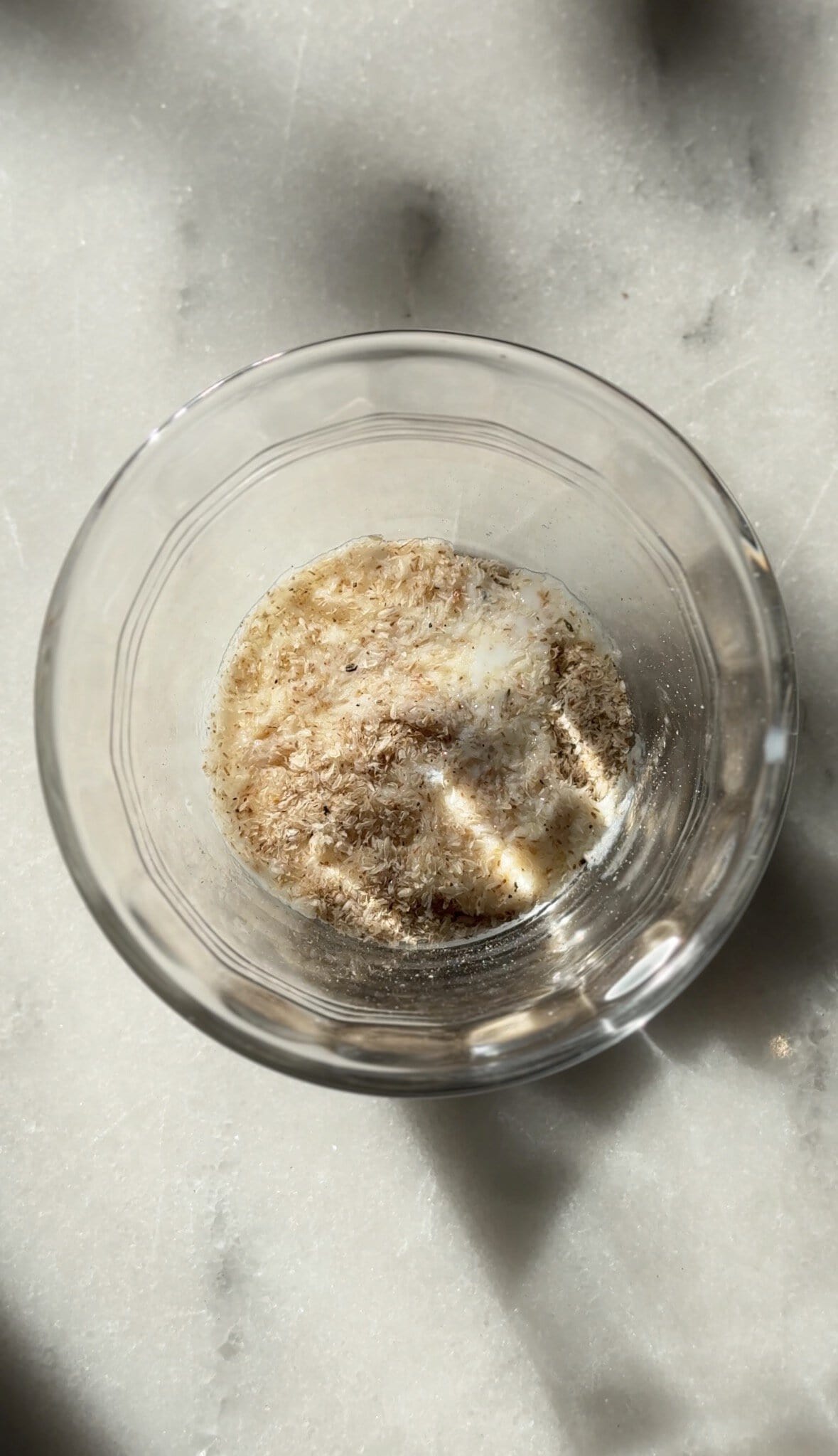 Mixing the psyllium husk and milk into a small bowl.