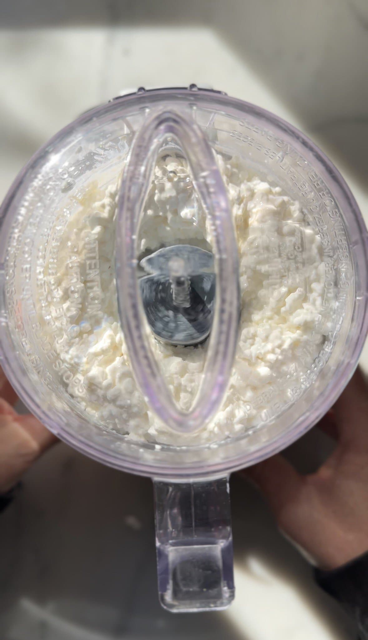 Blending the cottage cheese for the gluten-free cinnamon rolls.