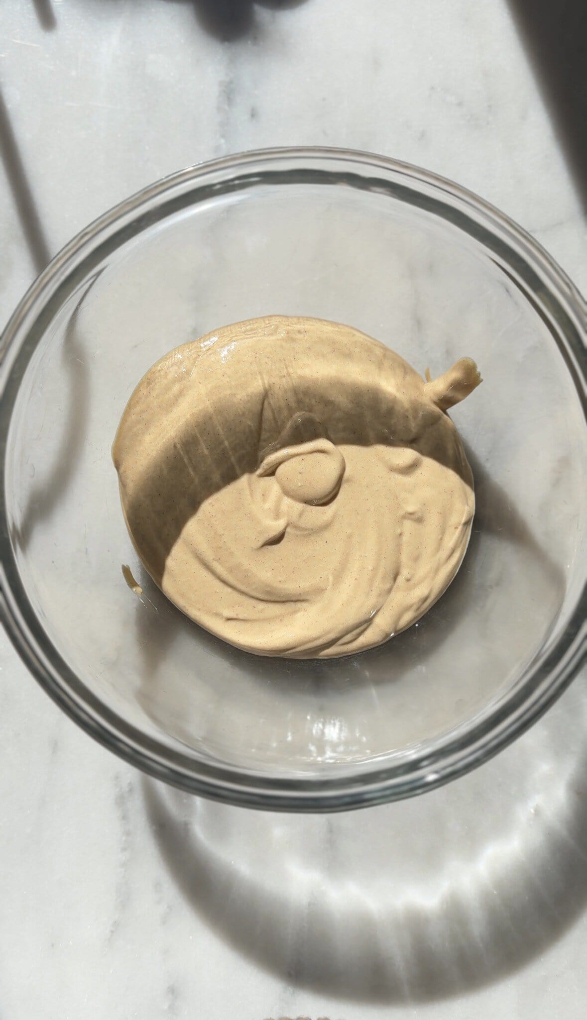 Pour all the wet ingredients of the Pumpkin Cottage Cheese Cookie Dough from the blender into a bowl.
